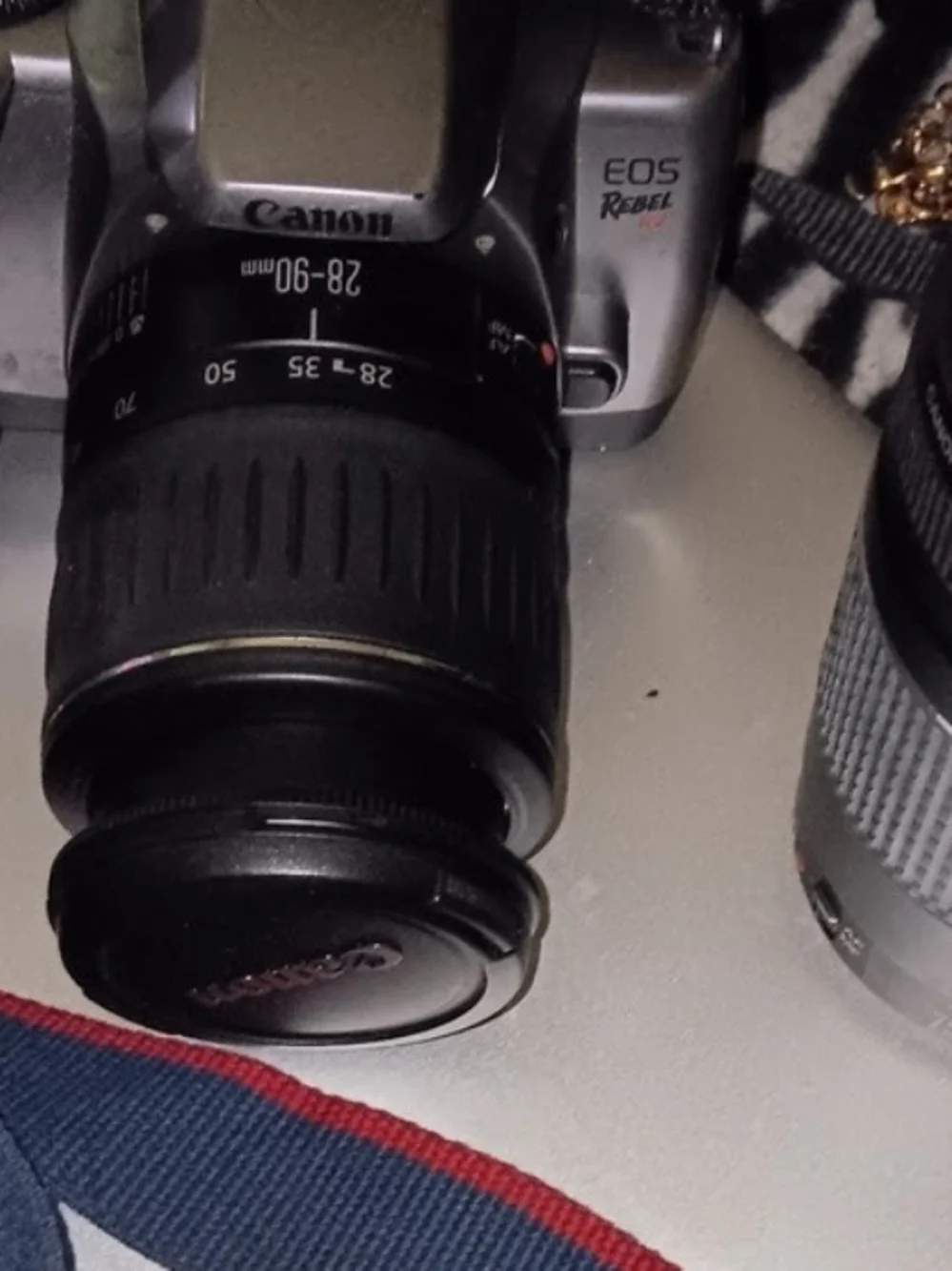 Canon DSLR Camera Body in Gray with Blue and Red Strap